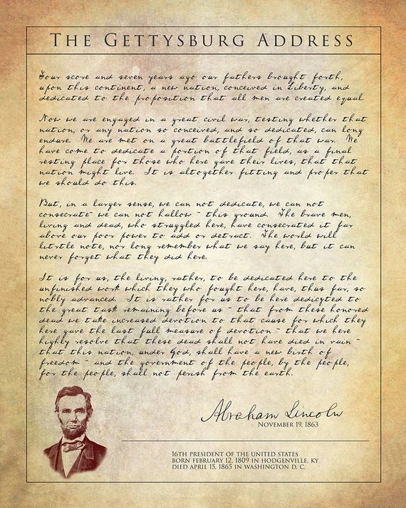 A parchment-style document displaying the Gettysburg Address with Abraham Lincolns portrait, his signature, and biographical details at the bottom. The text begins: Four score and seven years ago….